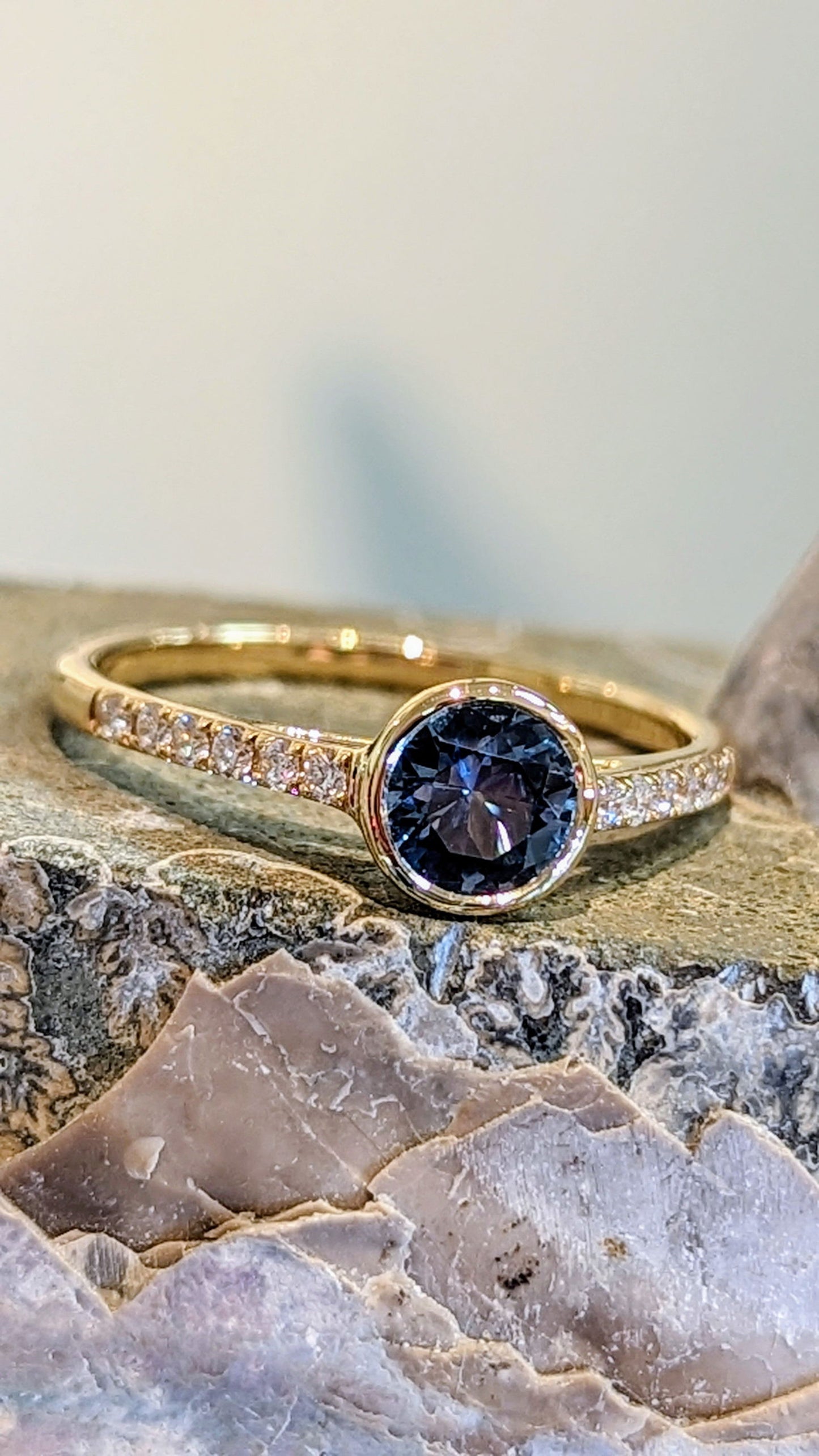 Photo of Stackable Montana Sapphire Ring in a decorative scene, designed by , available at Plumb Gold & Plumb Silver