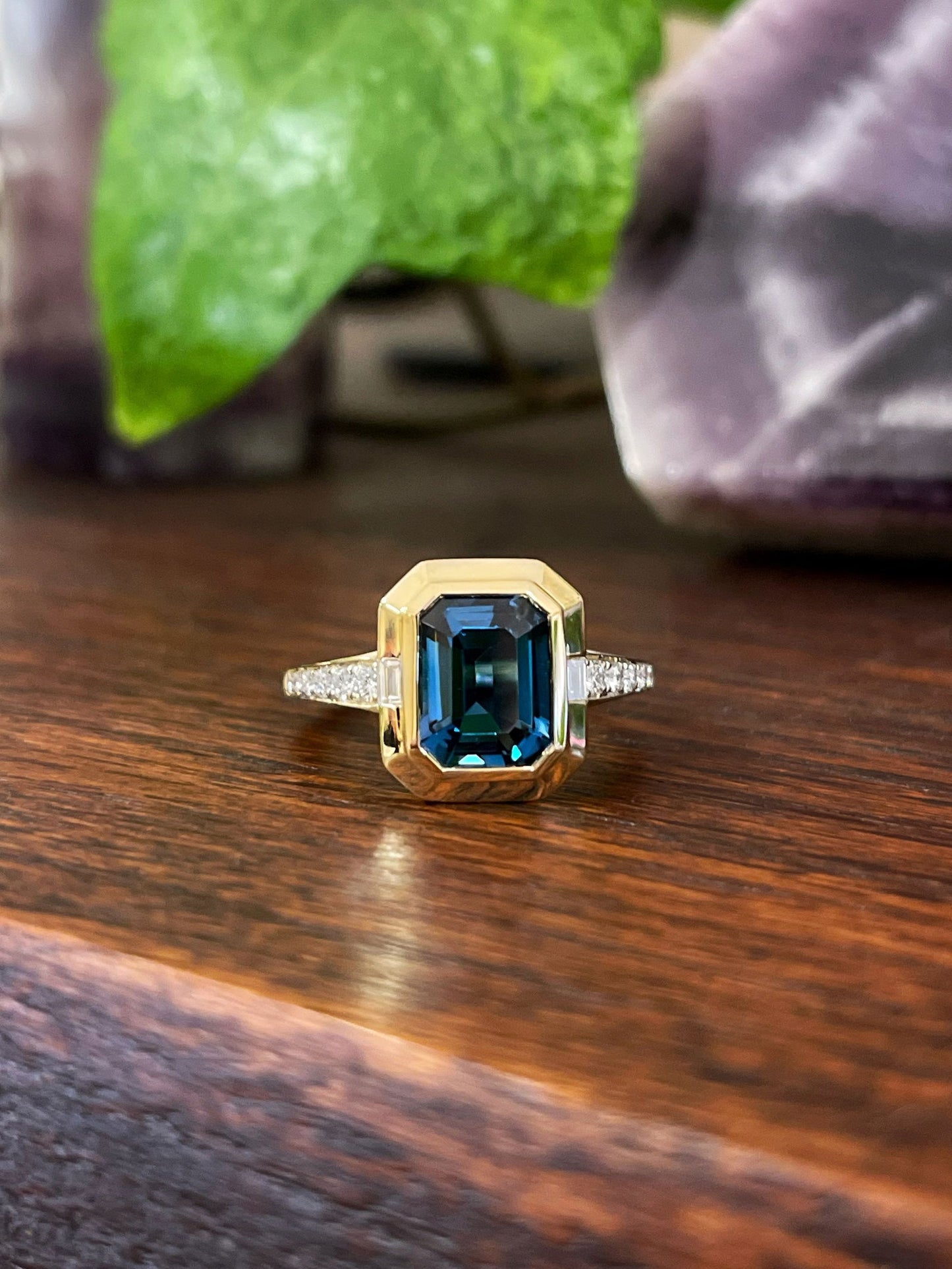 Photo of Stanton Color London Blue Topaz Ring in a decorative scene, designed by , available at Plumb Gold & Plumb Silver