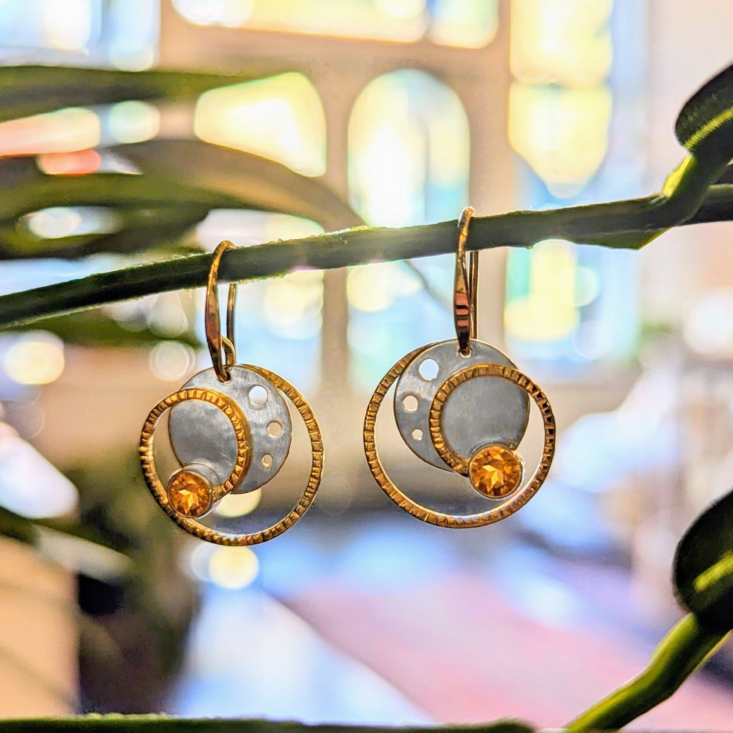 Photo of "Stellar" Earrings in a decorative scene, designed by , available at Plumb Gold & Plumb Silver