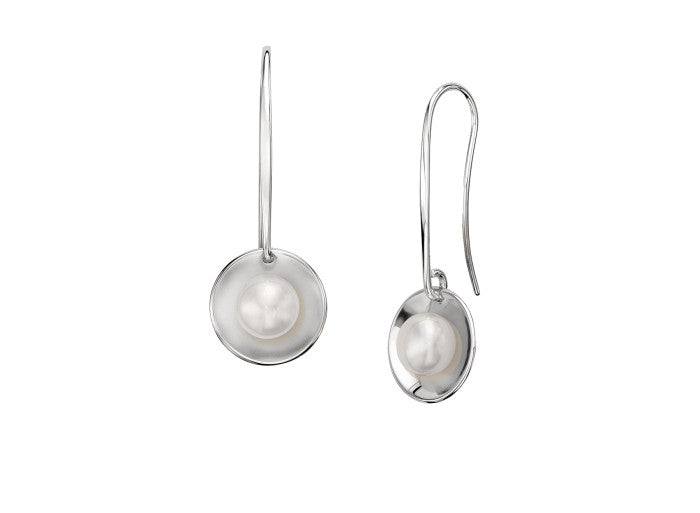 Photo of "Sun Glow" Pearl Earrings in a decorative scene, designed by , available at Plumb Gold & Plumb Silver