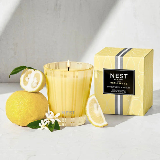 Photo of Sunlit Yuzu and Neroli Candle in a decorative scene, designed by , available at Plumb Gold & Plumb Silver