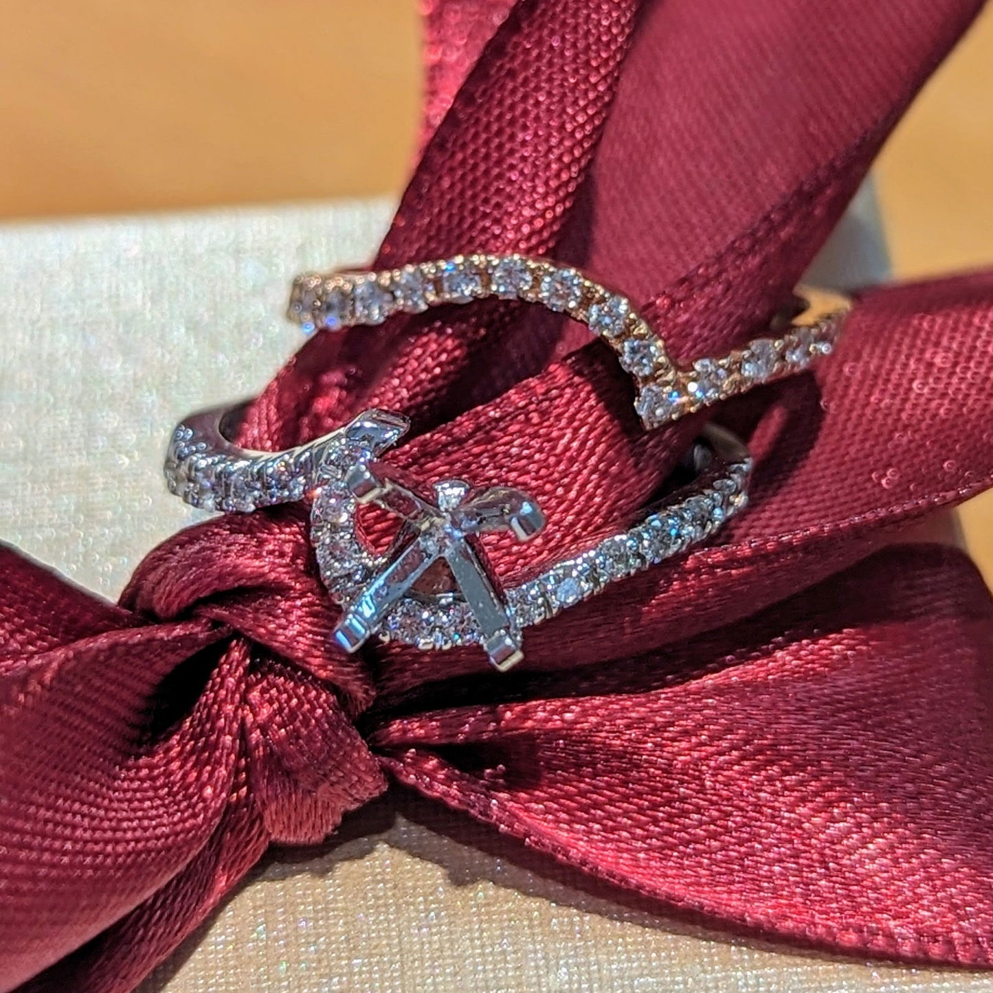 Photo of Swirl Engagement Ring Mounting in a decorative scene, designed by , available at Plumb Gold & Plumb Silver