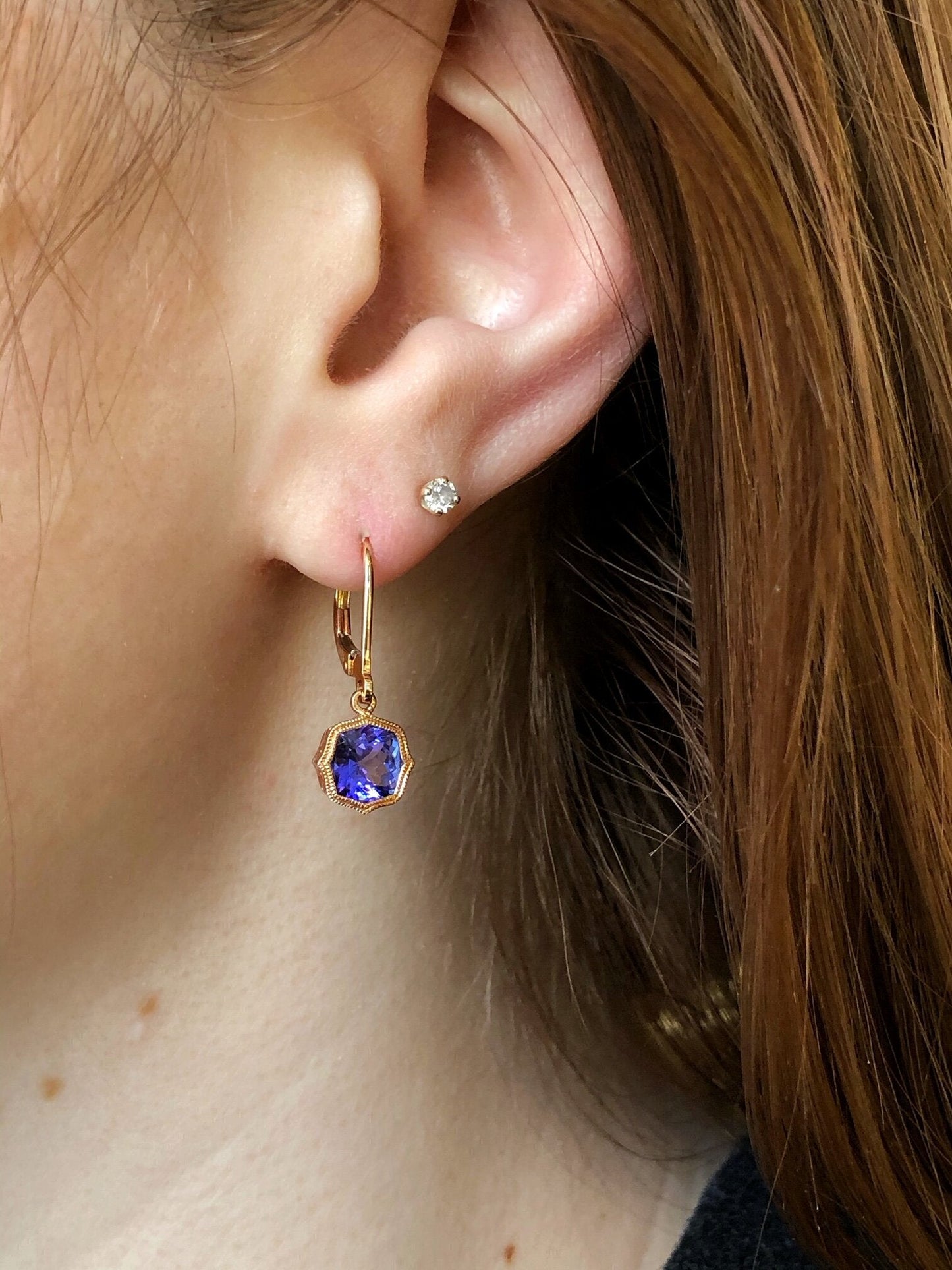 Photo of Tanzanite Dangles in a decorative scene, designed by , available at Plumb Gold & Plumb Silver
