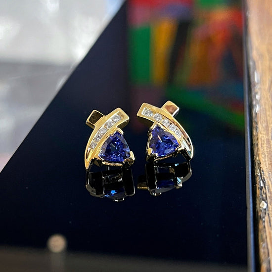 Photo of Tanzanite and Diamond Studs in a decorative scene, designed by , available at Plumb Gold & Plumb Silver