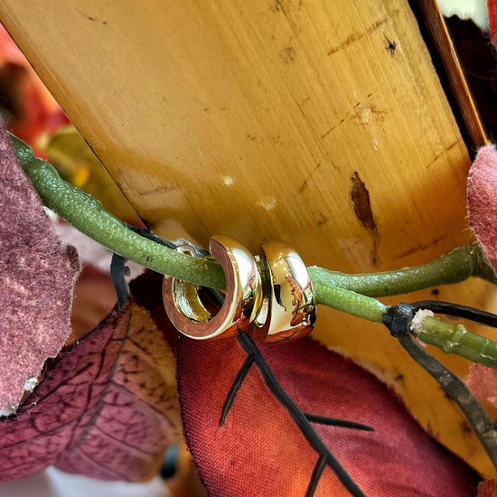 Photo of Tapered Huggies in a decorative scene, designed by , available at Plumb Gold & Plumb Silver