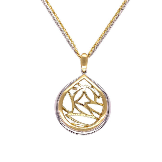 Photo of Teardrop Leaf Pendant in a decorative scene, designed by , available at Plumb Gold & Plumb Silver