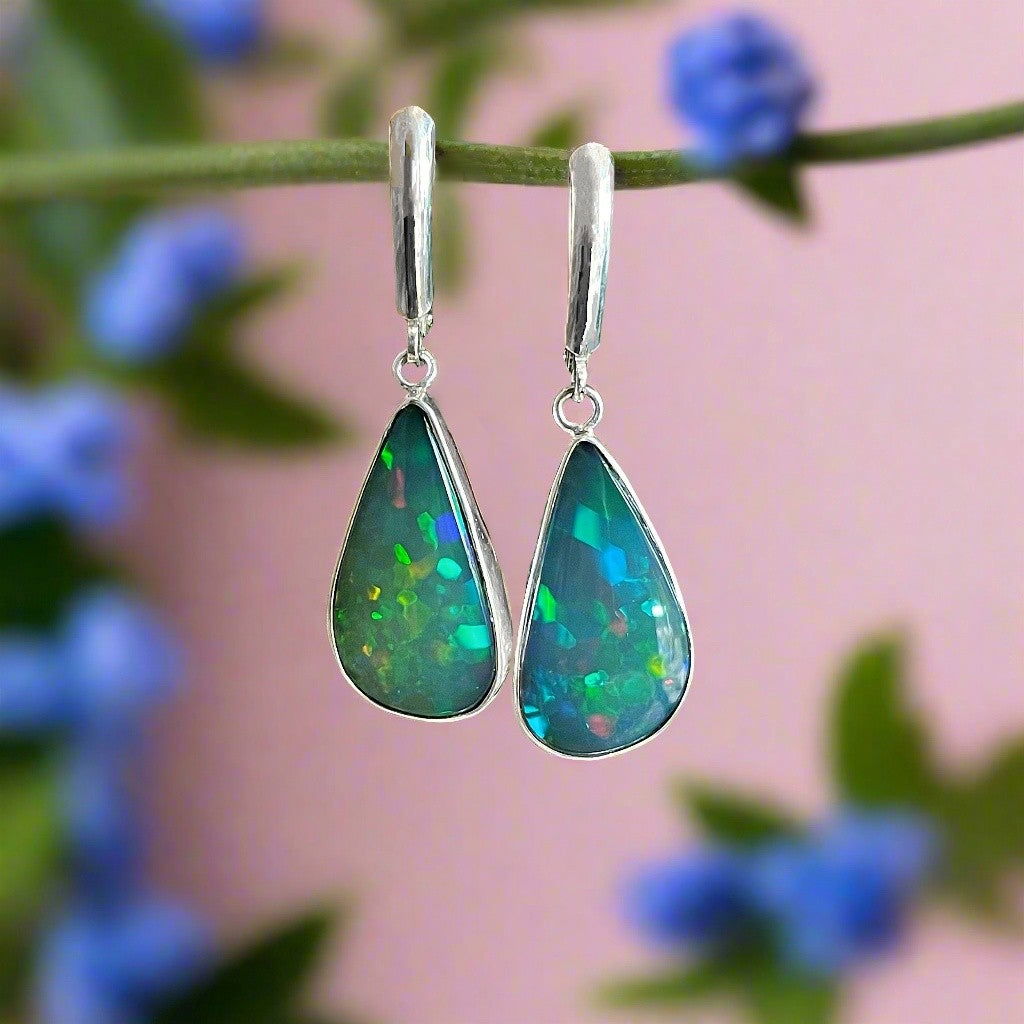 Photo of Teardrop Opal Dangles in a decorative scene, designed by , available at Plumb Gold & Plumb Silver