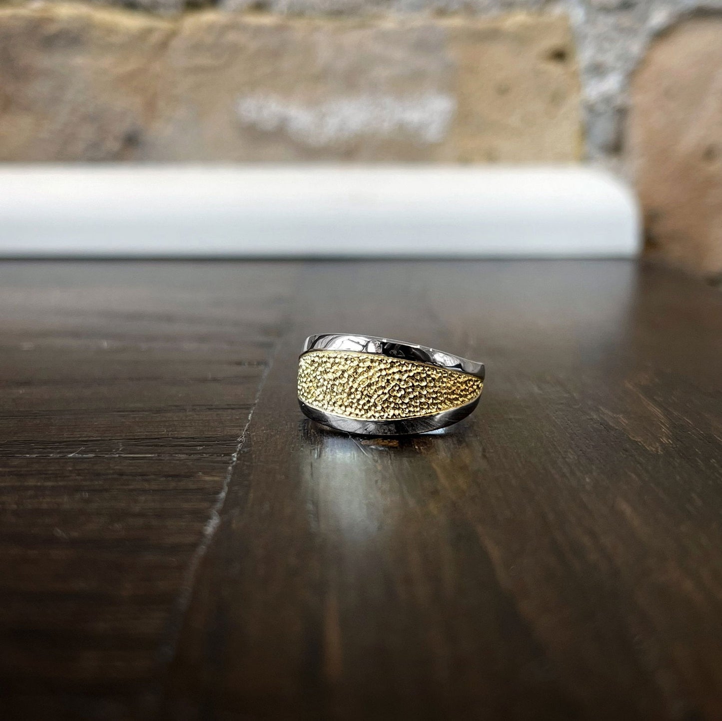 Photo of Textured Ring in a decorative scene, designed by , available at Plumb Gold & Plumb Silver