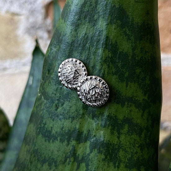Photo of Textured Studs in a decorative scene, designed by , available at Plumb Gold & Plumb Silver