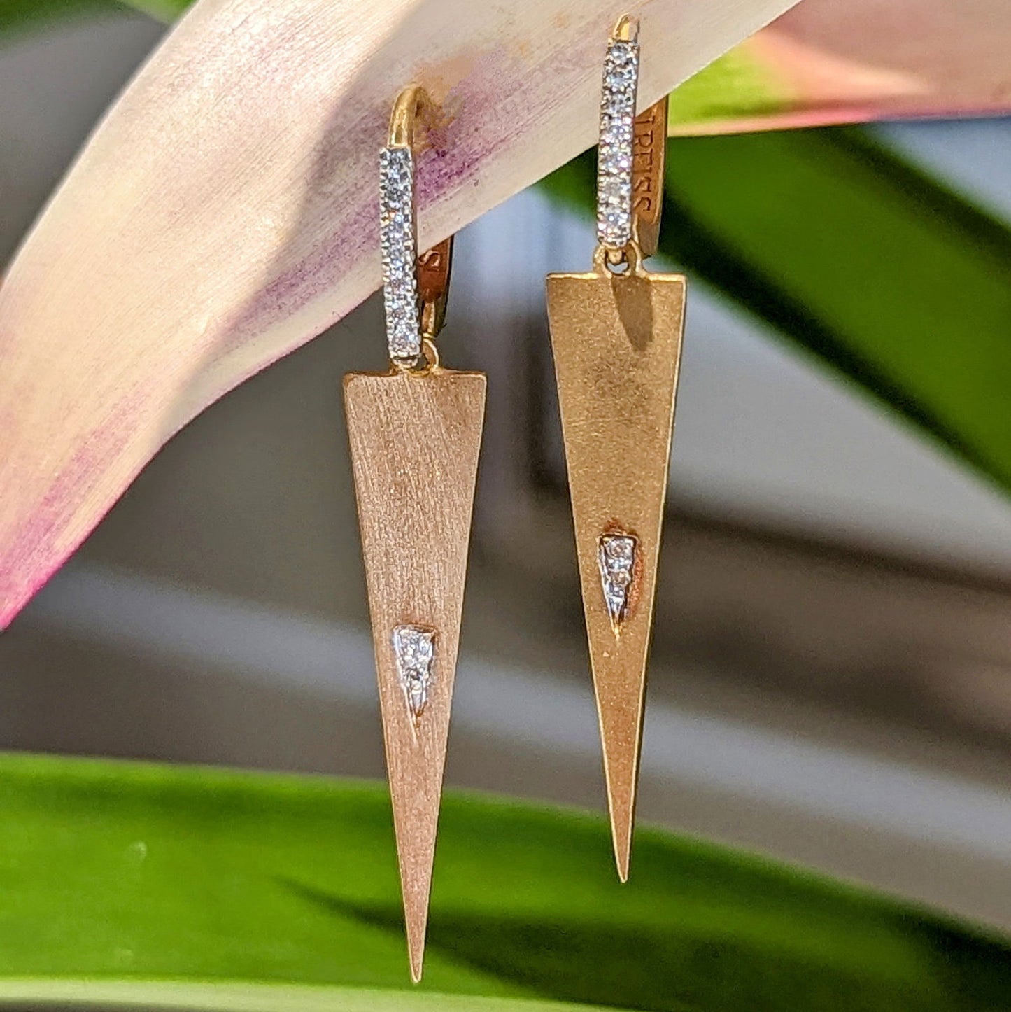 Photo of Triangle Dangles in a decorative scene, designed by , available at Plumb Gold & Plumb Silver