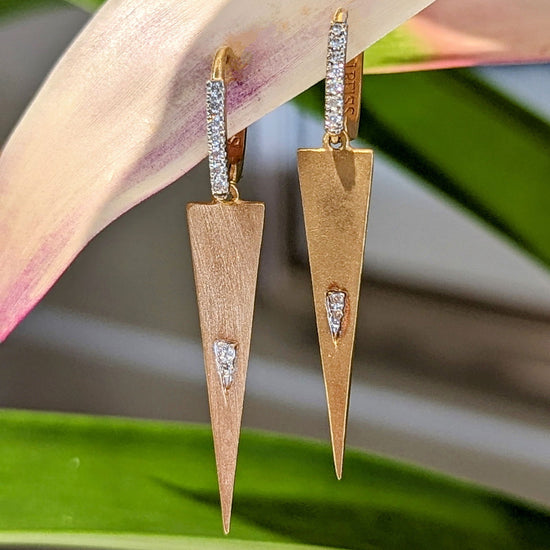 Photo of Triangle Dangles in a decorative scene, designed by , available at Plumb Gold & Plumb Silver