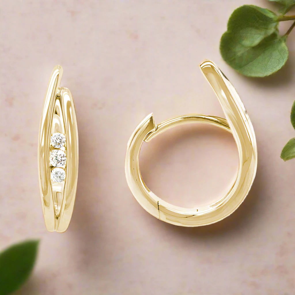 Photo of Triple Diamond Hinge Earring in a decorative scene, designed by , available at Plumb Gold & Plumb Silver