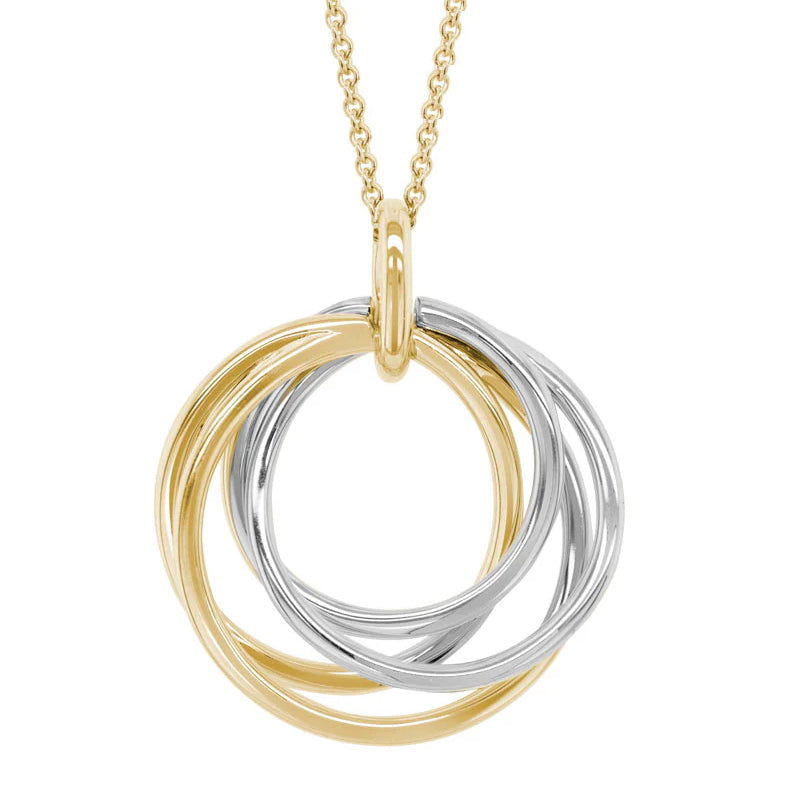 Photo of Twisting Circles Pendant in a decorative scene, designed by , available at Plumb Gold & Plumb Silver