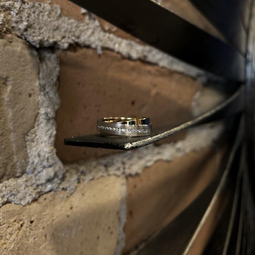 Photo of Two-Tone Crossover Ring in a decorative scene, designed by , available at Plumb Gold & Plumb Silver