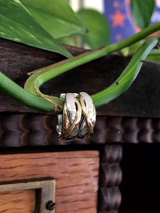 Photo of Two-Tone Huggies in a decorative scene, designed by , available at Plumb Gold & Plumb Silver