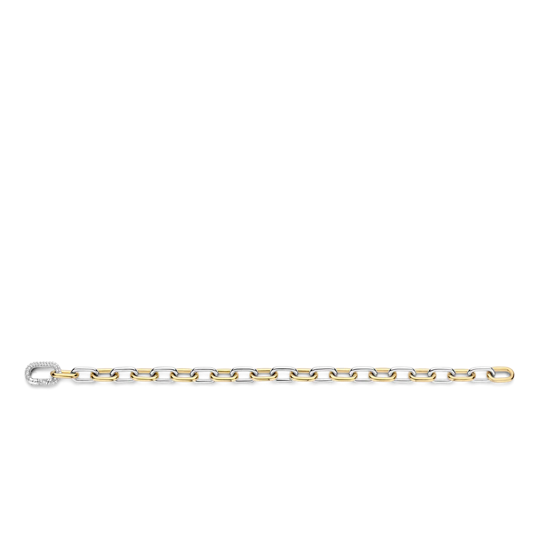 Photo of Two Tone Cable Bracelet in a decorative scene, designed by -, available at Plumb Gold & Plumb Silver