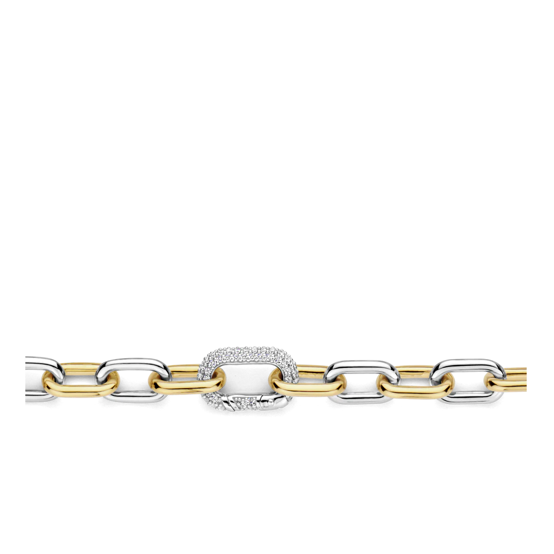 Photo of Two Tone Cable Bracelet in a decorative scene, designed by -, available at Plumb Gold & Plumb Silver