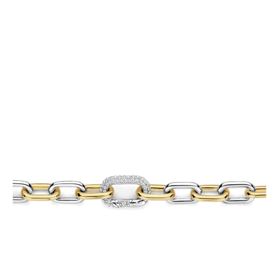 Photo of Two Tone Cable Bracelet in a decorative scene, designed by -, available at Plumb Gold & Plumb Silver