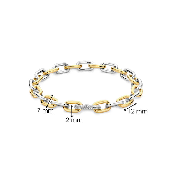 Photo of Two Tone Cable Bracelet in a decorative scene, designed by -, available at Plumb Gold & Plumb Silver