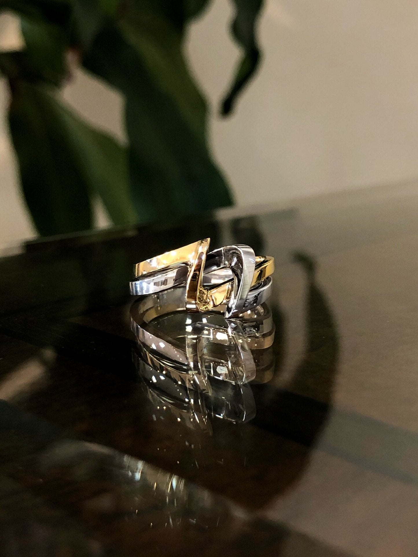 Photo of Two Tone Free Form Ring in a decorative scene, designed by , available at Plumb Gold & Plumb Silver