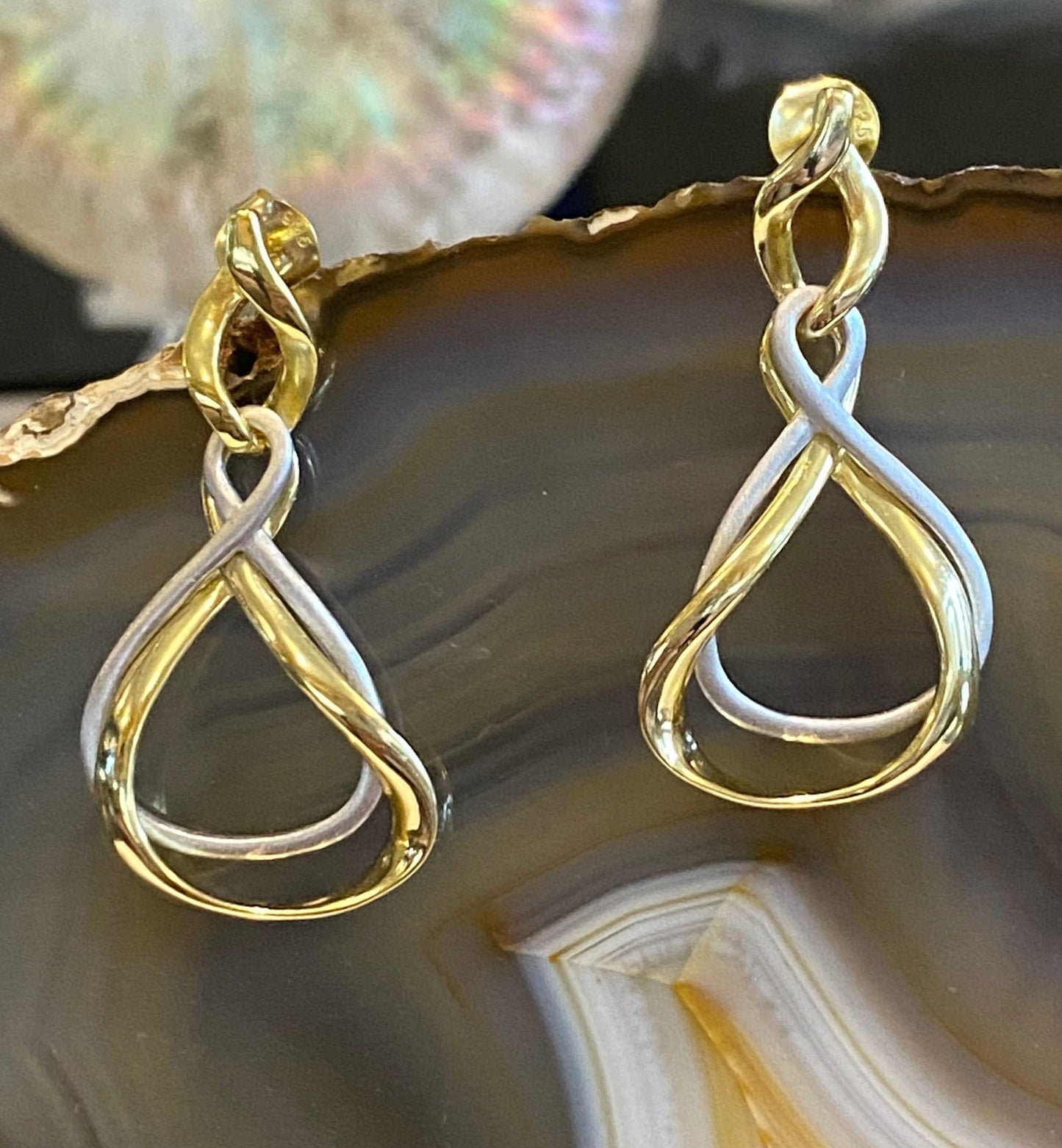 Photo of “Venice” Two Tone Dangles in a decorative scene, designed by , available at Plumb Gold & Plumb Silver