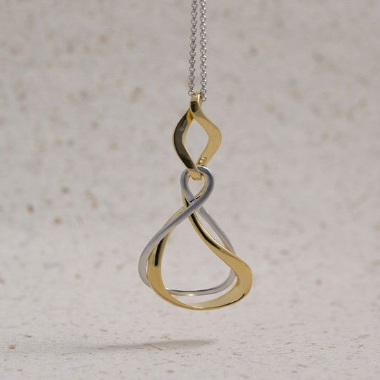 Photo of “Venice” Two Tone Pendant in a decorative scene, designed by , available at Plumb Gold & Plumb Silver