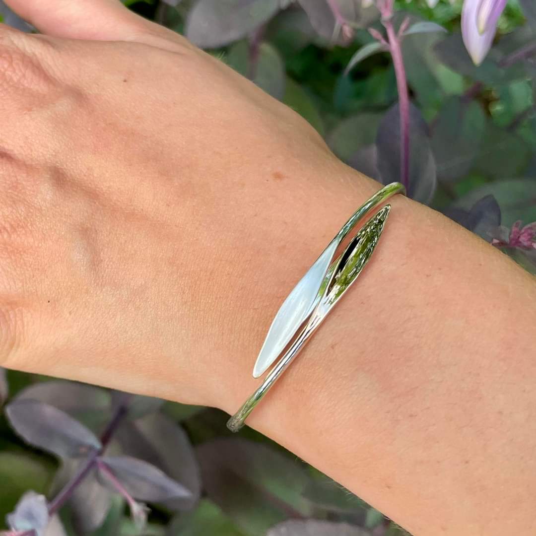 Photo of "Willow" Bracelet in a decorative scene, designed by , available at Plumb Gold & Plumb Silver