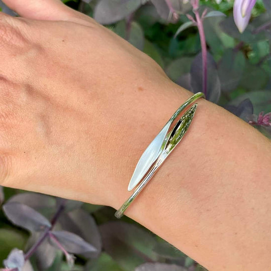 Photo of "Willow" Bracelet in a decorative scene, designed by , available at Plumb Gold & Plumb Silver