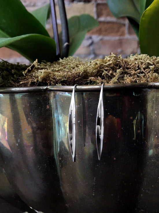 Photo of "Willow" Earrings in a decorative scene, designed by , available at Plumb Gold & Plumb Silver