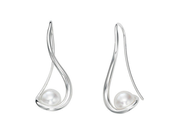 Photo of "Wind Spinner" Earrings in a decorative scene, designed by , available at Plumb Gold & Plumb Silver