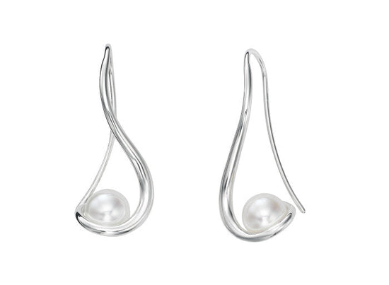 Photo of "Wind Spinner" Earrings in a decorative scene, designed by , available at Plumb Gold & Plumb Silver