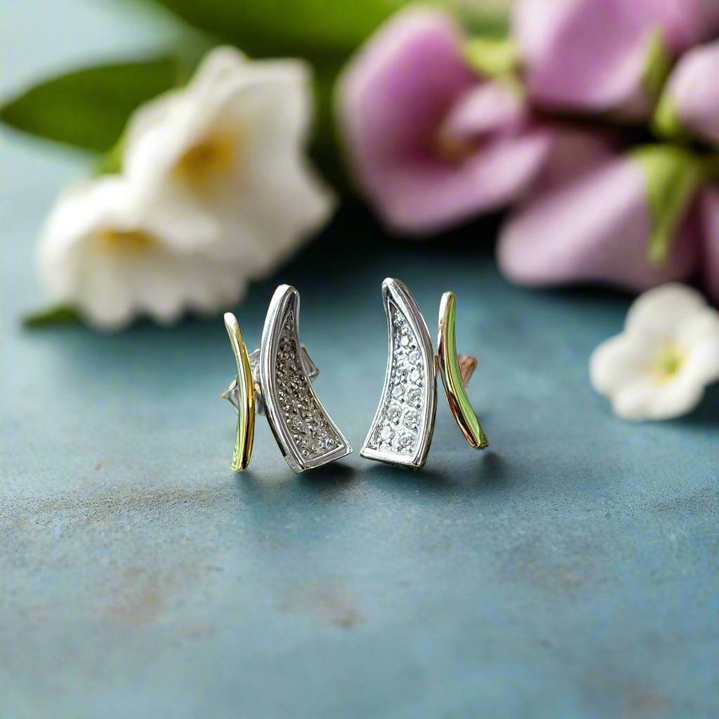 Photo of "Wish" Earrings in a decorative scene, designed by , available at Plumb Gold & Plumb Silver