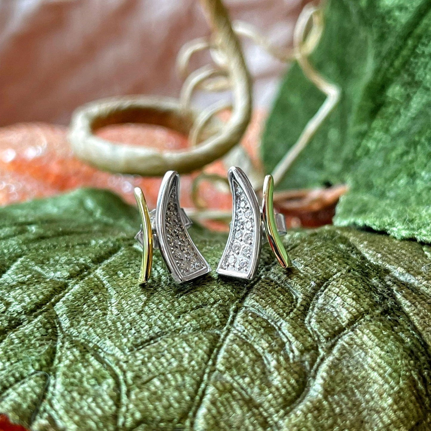 Photo of "Wish" Earrings in a decorative scene, designed by , available at Plumb Gold & Plumb Silver