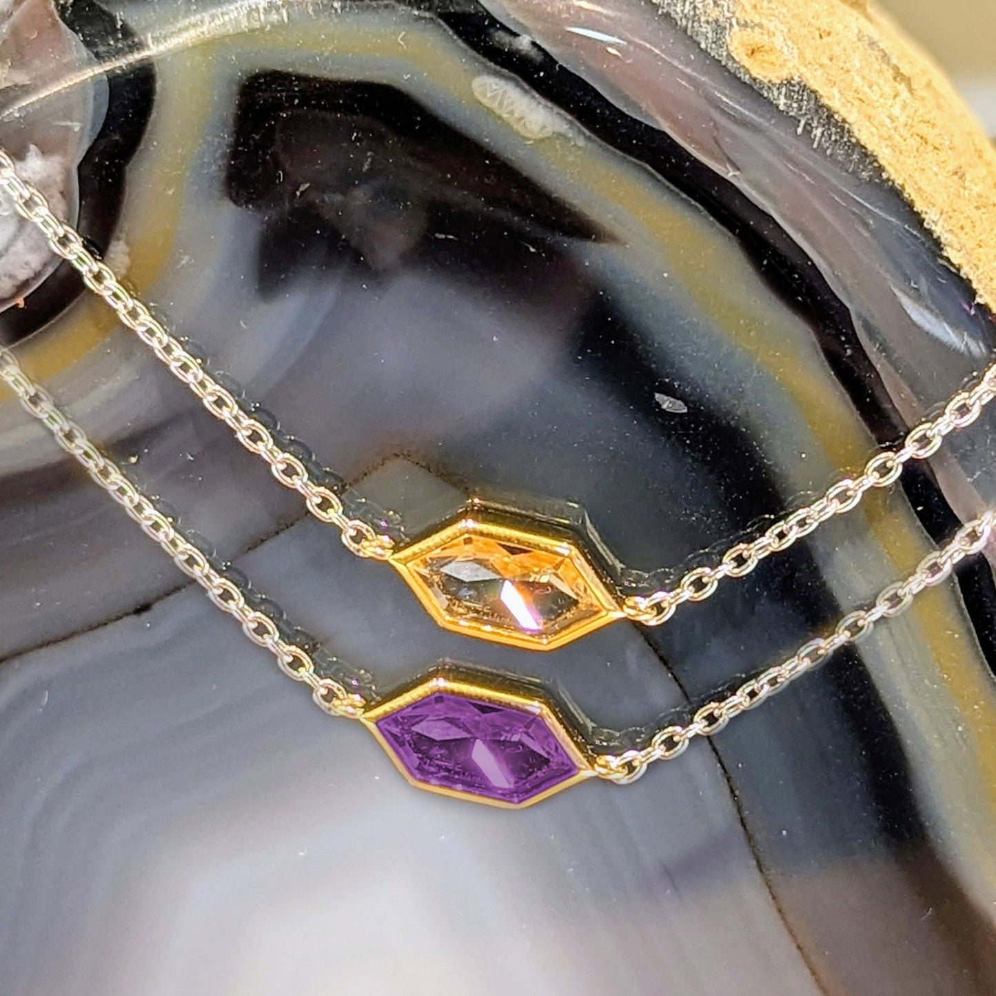 Photo of Yellow gold Plate Accented CZ Hexagon Bracelet in a decorative scene, designed by , available at Plumb Gold & Plumb Silver