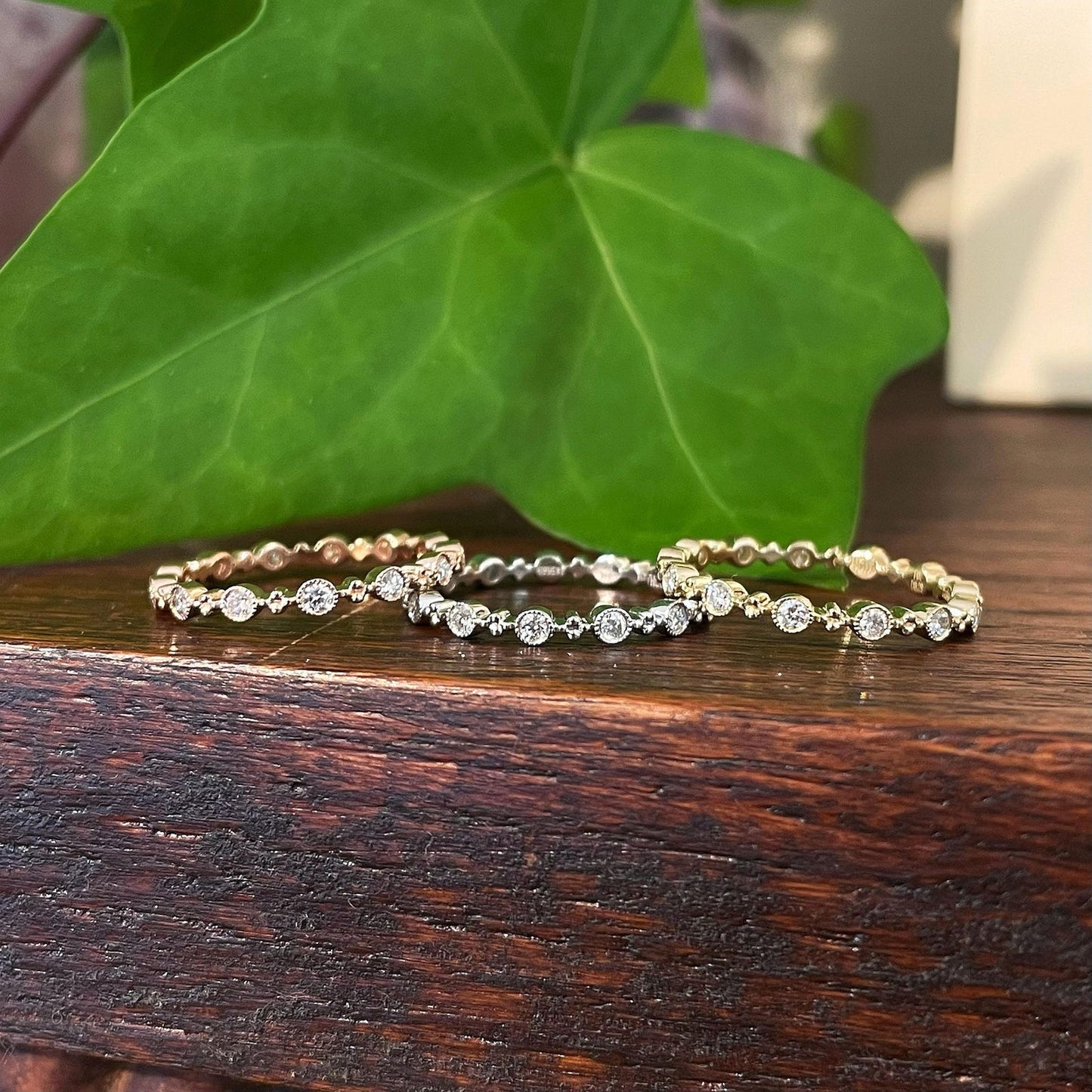 Photo of Zeghani Milgrain Diamond Band in a decorative scene, designed by , available at Plumb Gold & Plumb Silver