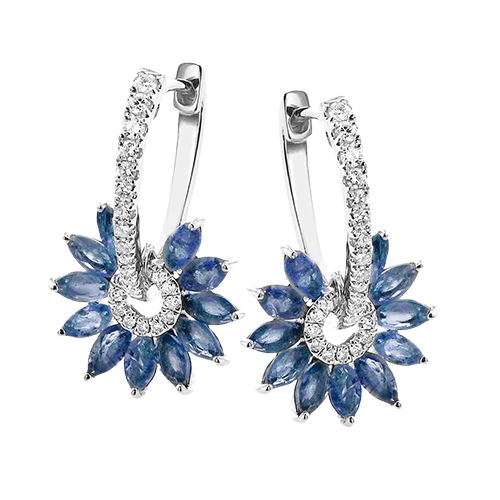 Photo of Zeghani Sapphire & Diamond Burst Hoops in a decorative scene, designed by , available at Plumb Gold & Plumb Silver