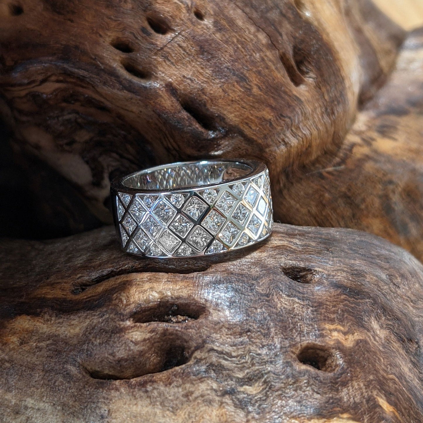 Photo of Zoma Color Diamond Lattice Ring in a decorative scene, designed by , available at Plumb Gold & Plumb Silver