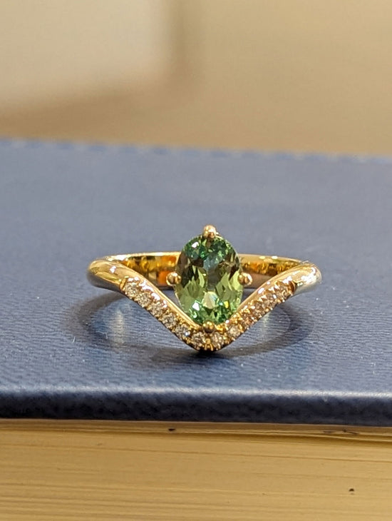 Photo of Zoma Color Mint Garnet and Diamond Ring in a decorative scene, designed by , available at Plumb Gold & Plumb Silver