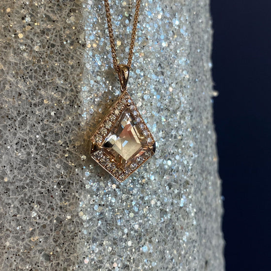 Photo of Zoma Color Precious Topaz Pendant in a decorative scene, designed by , available at Plumb Gold & Plumb Silver