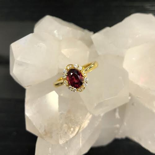 Photo of Zoma Color Red Spinel Filigree Ring in a decorative scene, designed by , available at Plumb Gold & Plumb Silver