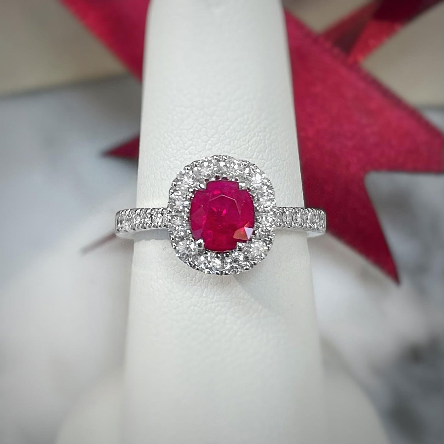 Photo of Zoma Color Ruby and Diamond Ring in a decorative scene, designed by , available at Plumb Gold & Plumb Silver
